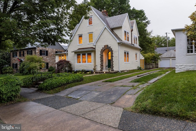 4404 Eastway, Baltimore, MD 21218 - view of front of home featuring a front yard, a chimney, and stucco siding
