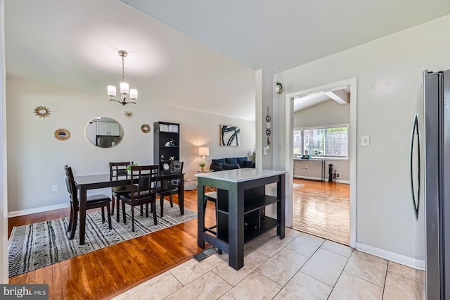 1201 Cobb Rd, Baltimore, MD 21208 - dining space with a chandelier, baseboards, and light tile patterned floors