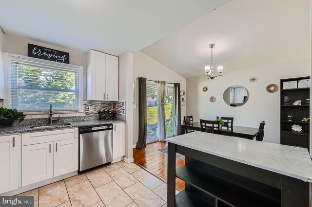 1201 Cobb Rd, Baltimore, MD 21208 - kitchen with stainless steel dishwasher, a sink, lofted ceiling, stone counters, and white cabinets