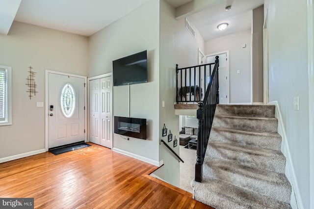 1201 Cobb Rd, Baltimore, MD 21208 - foyer with hardwood / wood-style floors, stairs, and baseboards
