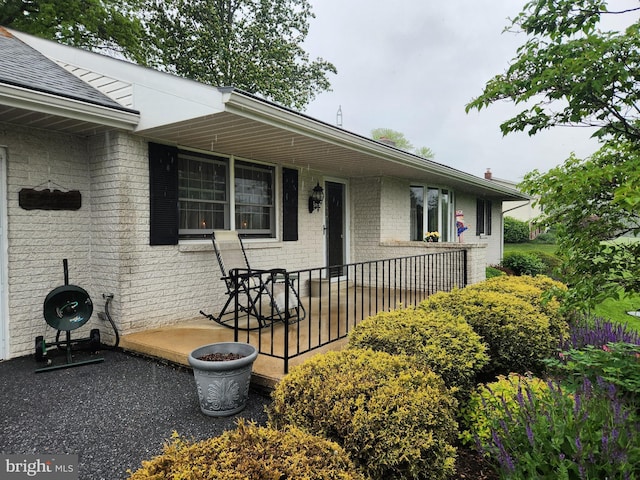 view of front of house featuring brick siding