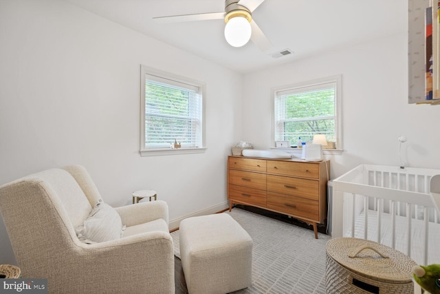16 E Monroe Ave, Alexandria, VA 22301 - bedroom with multiple windows, baseboards, a nursery area, and a ceiling fan