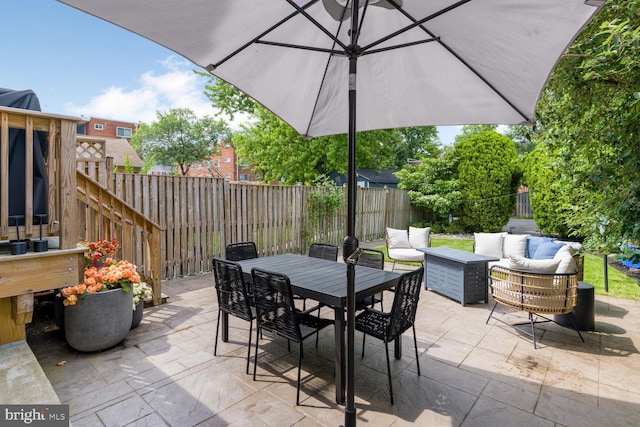 16 E Monroe Ave, Alexandria, VA 22301 - fenced backyard featuring an outdoor living space, a patio area, and outdoor dining area