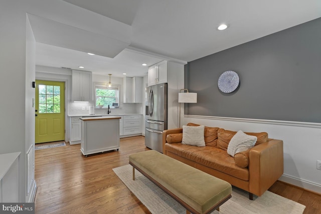 16 E Monroe Ave, Alexandria, VA 22301 - living area with light wood-style floors and recessed lighting