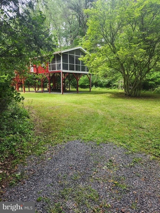 1615 Kilgore Rd, Paw Paw, WV 25434 - view of green lawn with a sunroom