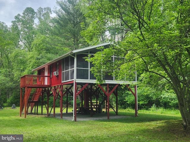 1615 Kilgore Rd, Paw Paw, WV 25434 - view of playground featuring a lawn, a sunroom, stairs, cooling unit, and a deck