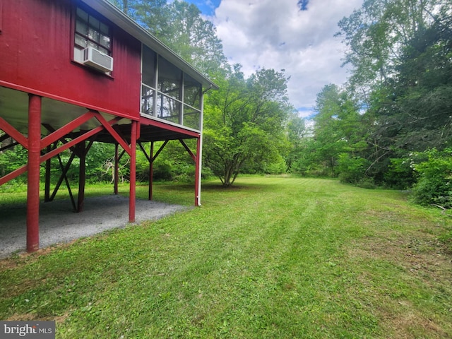 1615 Kilgore Rd, Paw Paw, WV 25434 - view of grassy yard featuring a patio area, a sunroom, and a carport