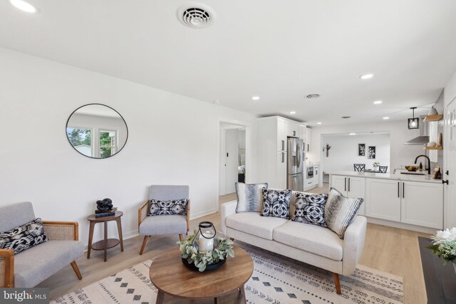 214 Dillard Ct, Front Royal, VA 22630 - living room with light wood finished floors, recessed lighting, and baseboards