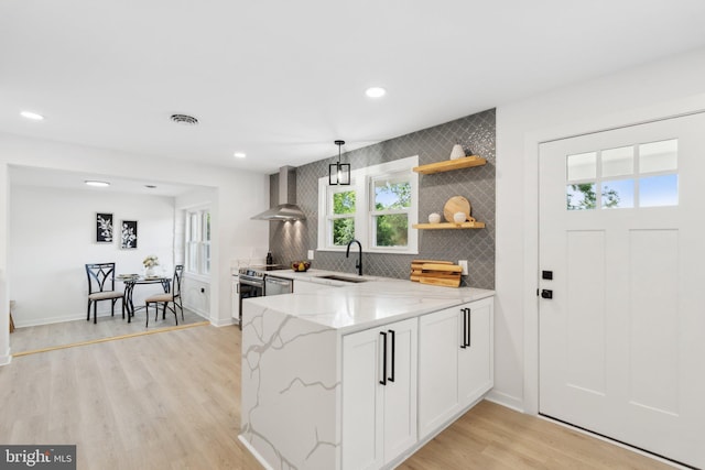 214 Dillard Ct, Front Royal, VA 22630 - kitchen featuring wall chimney range hood, a sink, light stone countertops, recessed lighting, and open shelves