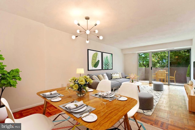 700 7th St SW Unit 507, Washington, DC 20024 - dining space featuring a chandelier and baseboards
