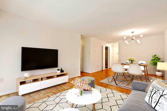 700 7th St SW Unit 507, Washington, DC 20024 - living room featuring baseboards and a chandelier