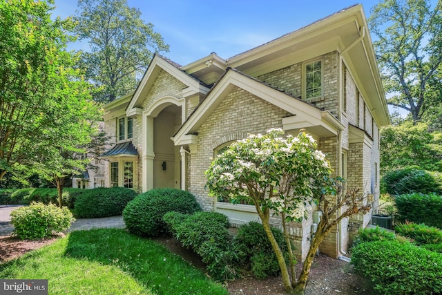 7005 Natelli Woods Ln, Bethesda, MD 20817 - view of front of property featuring brick siding and central air condition unit