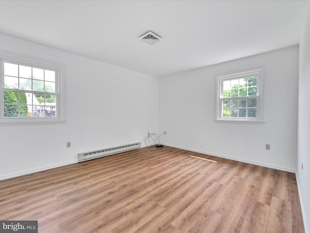 719 Loblolly Ln, Reading, PA 19607 - unfurnished room with a baseboard radiator, light wood finished floors, and baseboards
