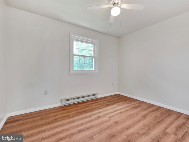 719 Loblolly Ln, Reading, PA 19607 - unfurnished room featuring baseboard heating, wood finished floors, baseboards, and a ceiling fan