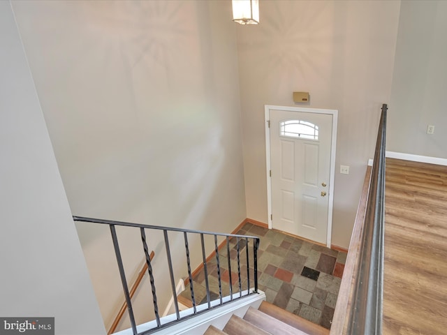 719 Loblolly Ln, Reading, PA 19607 - entrance foyer with baseboards, stone finish floors, and stairs