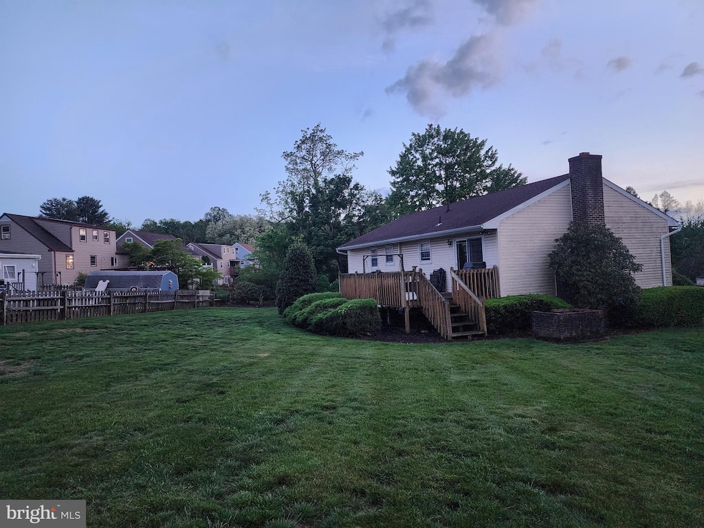 719 Loblolly Ln, Reading, PA 19607 - rear view of property with a chimney and a wooden deck