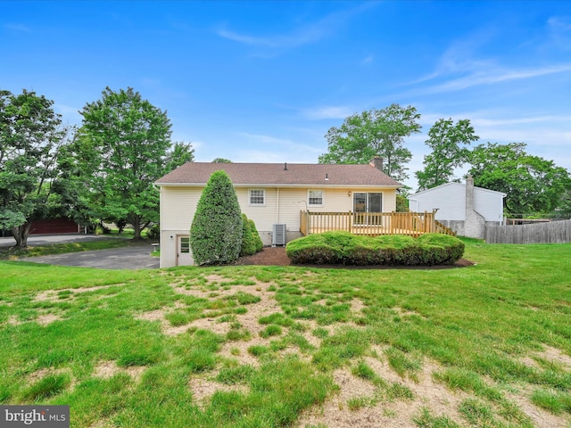 719 Loblolly Ln, Reading, PA 19607 - rear view of property with cooling unit, a wooden deck, and a chimney