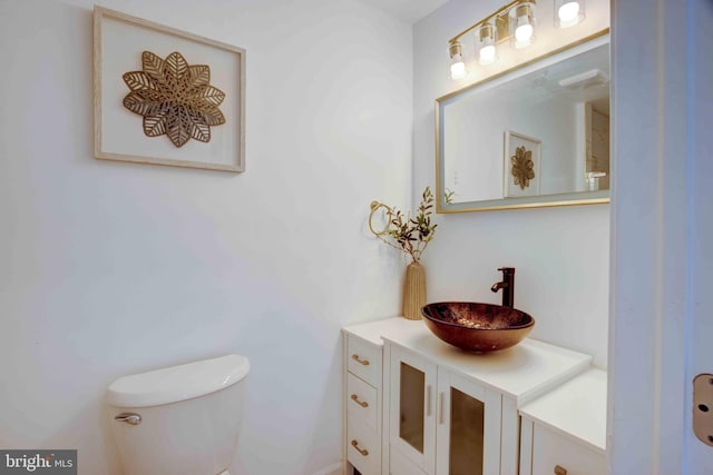 1625 Belt St, Baltimore, MD 21230 - half bathroom featuring vanity and toilet