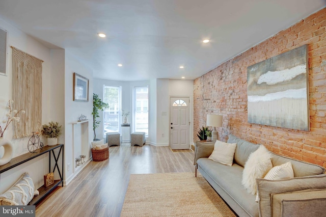 1625 Belt St, Baltimore, MD 21230 - living area featuring wood finished floors, baseboards, recessed lighting, and brick wall