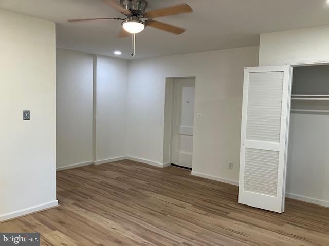 4027 Benton St NW Unit 101, Washington, DC 20007 - unfurnished bedroom featuring wood finished floors, baseboards, a closet, and recessed lighting