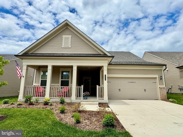 15741 Gardenia Ridge Way, Haymarket, VA 20169 - view of front of home with covered porch, a garage, and concrete driveway