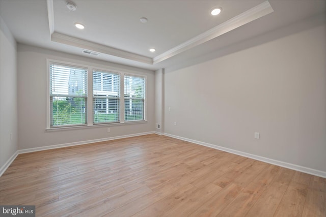 15741 Gardenia Ridge Way, Haymarket, VA 20169 - empty room featuring a raised ceiling, ornamental molding, light wood-style flooring, a smoke detector, and baseboards