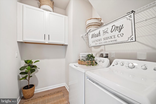 15741 Gardenia Ridge Way, Haymarket, VA 20169 - washroom featuring washer and dryer, cabinet space, wood finished floors, and baseboards