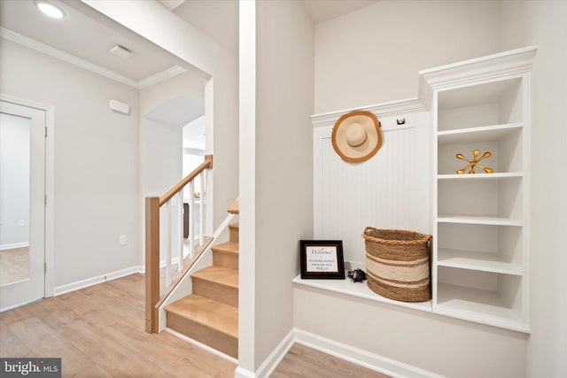 15741 Gardenia Ridge Way, Haymarket, VA 20169 - mudroom with wood finished floors, ornamental molding, arched walkways, and baseboards