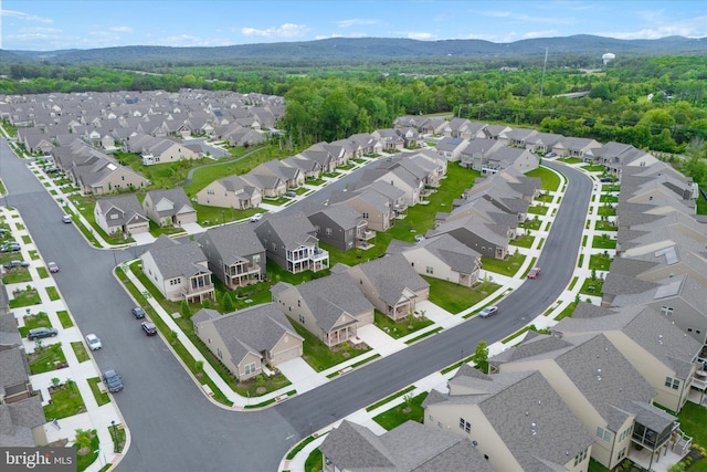 15741 Gardenia Ridge Way, Haymarket, VA 20169 - aerial perspective of suburban area featuring a mountain backdrop and a heavily wooded area