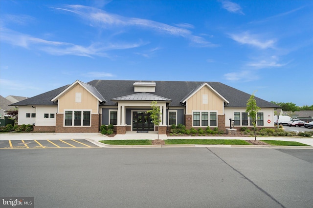 15741 Gardenia Ridge Way, Haymarket, VA 20169 - view of front facade featuring brick siding, board and batten siding, and a standing seam roof