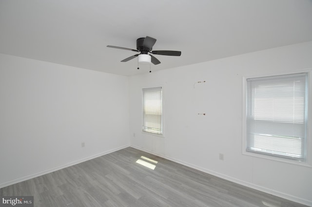 1249 Morse St NE, Washington, DC 20002 - empty room featuring wood finished floors, healthy amount of natural light, a ceiling fan, and baseboards