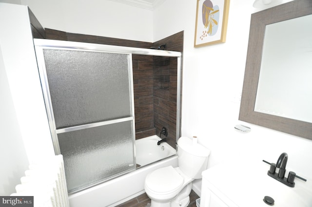 1249 Morse St NE, Washington, DC 20002 - bathroom with crown molding, combined bath / shower with glass door, toilet, and vanity