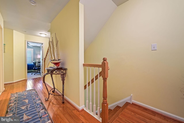 19830 Church St Unit 26, Rehoboth Beach, DE 19971 - hallway with hardwood / wood-style floors, an upstairs landing, and baseboards