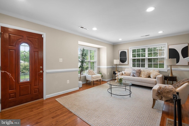 3949 Taney Ave, Alexandria, VA 22304 - living room with wood finished floors, recessed lighting, baseboards, and crown molding