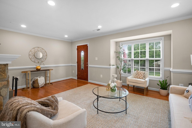 3949 Taney Ave, Alexandria, VA 22304 - living area featuring wood finished floors, recessed lighting, ornamental molding, a fireplace, and baseboards