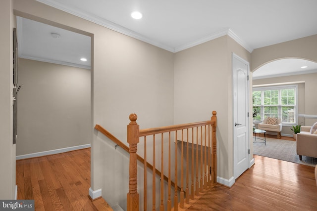 3949 Taney Ave, Alexandria, VA 22304 - hallway with an upstairs landing, wood finished floors, crown molding, baseboards, and arched walkways