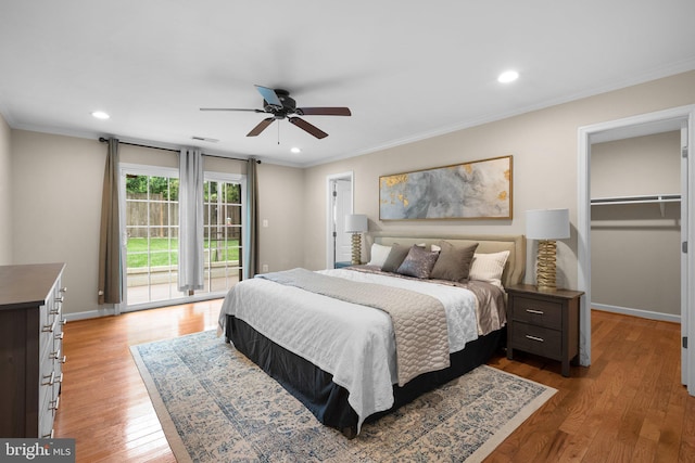 3949 Taney Ave, Alexandria, VA 22304 - bedroom with access to exterior, wood finished floors, a walk in closet, ornamental molding, and baseboards