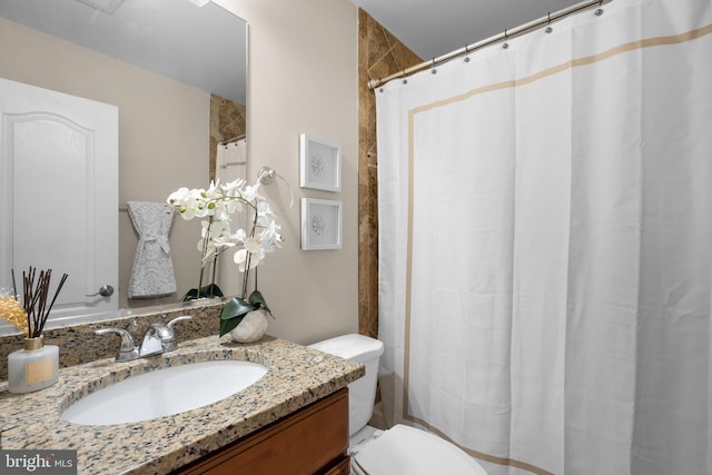 3949 Taney Ave, Alexandria, VA 22304 - bathroom featuring vanity, toilet, and curtained shower