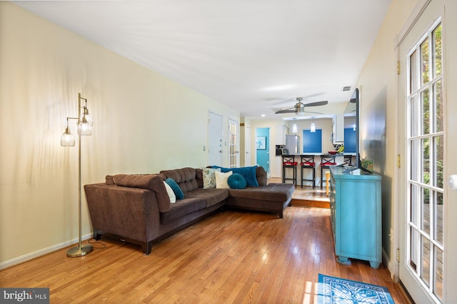 5455 Crowflock Ct, Columbia, MD 21045 - living area featuring light wood-type flooring, a ceiling fan, and baseboards