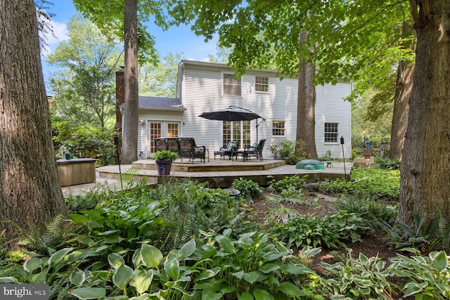 5455 Crowflock Ct, Columbia, MD 21045 - rear view of house with a wooden deck, a chimney, and french doors