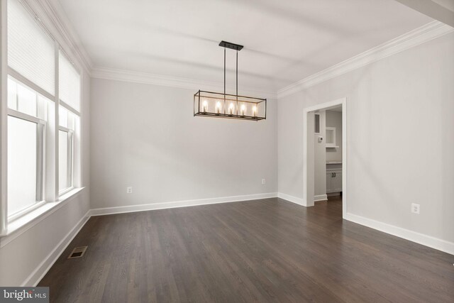 7101 27th Rd N, Arlington, VA 22213 - spare room featuring a chandelier, crown molding, dark wood-type flooring, and baseboards
