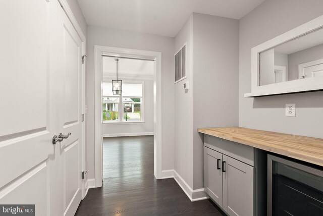 7101 27th Rd N, Arlington, VA 22213 - hallway with beverage cooler, dark wood-type flooring, and baseboards