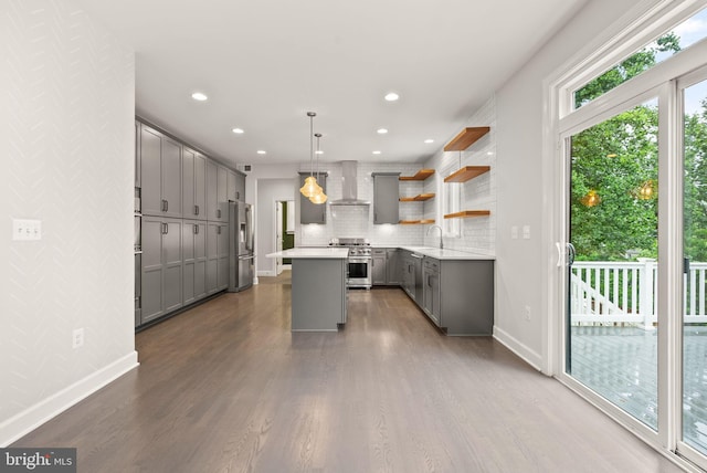 7101 27th Rd N, Arlington, VA 22213 - kitchen with gray cabinetry, wall chimney exhaust hood, appliances with stainless steel finishes, dark wood-style floors, and a center island