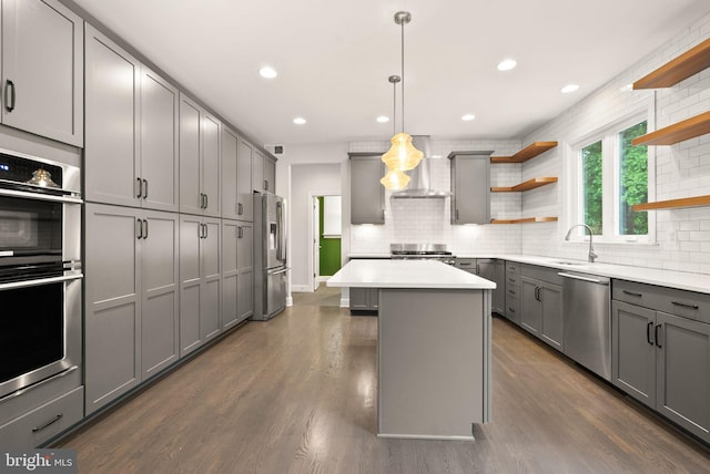 7101 27th Rd N, Arlington, VA 22213 - kitchen featuring open shelves, stainless steel appliances, wall chimney exhaust hood, gray cabinetry, and a sink
