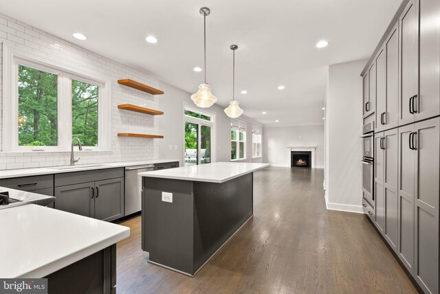 7101 27th Rd N, Arlington, VA 22213 - kitchen with a sink, appliances with stainless steel finishes, a kitchen island, recessed lighting, and tasteful backsplash
