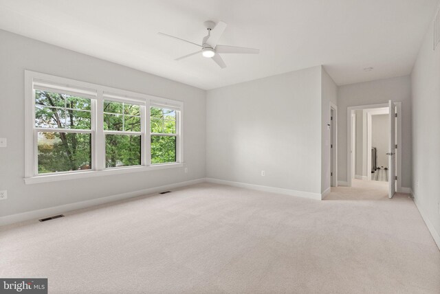 7101 27th Rd N, Arlington, VA 22213 - spare room featuring light carpet, a ceiling fan, and baseboards