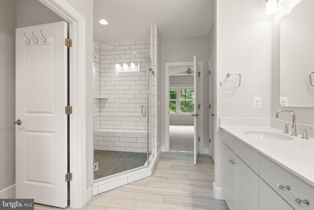 7101 27th Rd N, Arlington, VA 22213 - full bath with vanity, a shower stall, a ceiling fan, wood finished floors, and baseboards