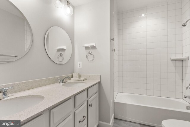 7101 27th Rd N, Arlington, VA 22213 - full bathroom with double vanity, tub / shower combination, and toilet