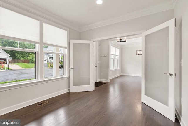7101 27th Rd N, Arlington, VA 22213 - empty room with ornamental molding, a chandelier, baseboards, french doors, and wood finished floors
