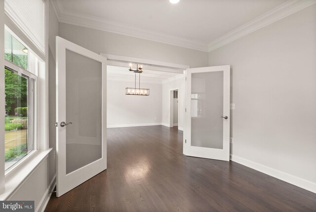 7101 27th Rd N, Arlington, VA 22213 - empty room featuring french doors, healthy amount of natural light, a chandelier, ornamental molding, and dark wood-type flooring
